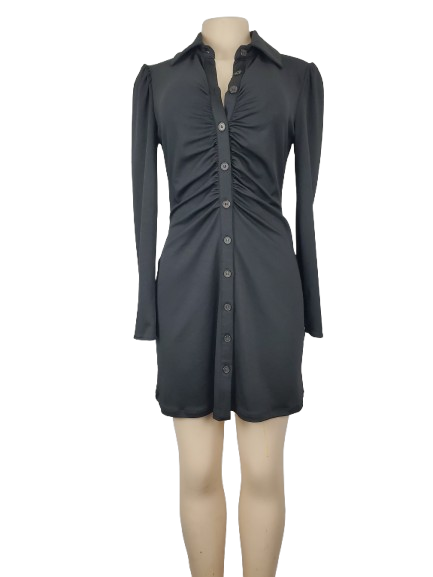 Black dress on a mannequin against a white background