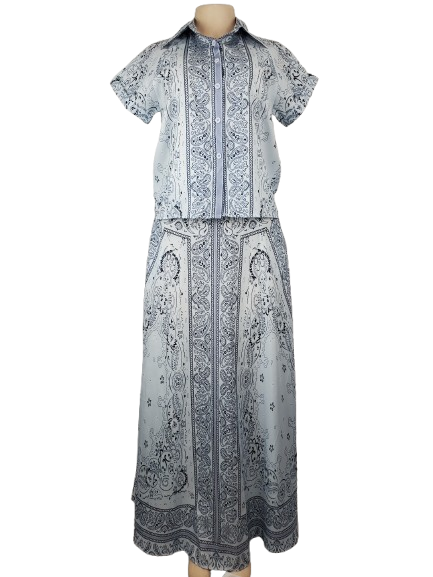 blue patterned dress on a mannequin against a white background