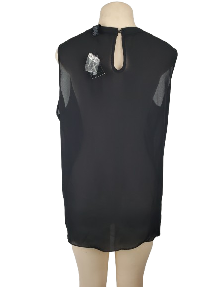 Black sleeveless top on a mannequin with a white background