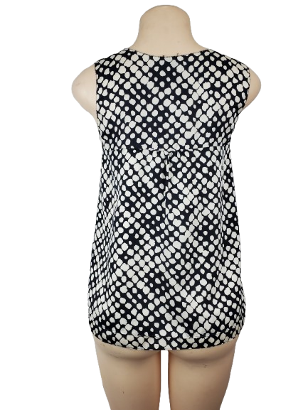 Black and white patterned sleeveless dress on a mannequin against a white background
