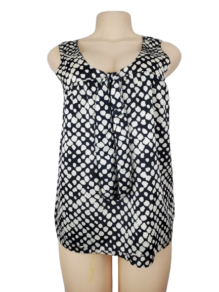Black and white patterned sleeveless top on a mannequin against a white background