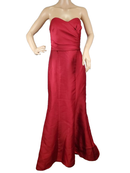 Red strapless gown on a mannequin against a white background