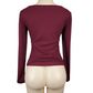 Maroon long-sleeve top on a mannequin against a white background