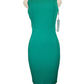 Green dress on a mannequin with a white background