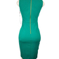 Green dress on a mannequin with a gold zipper back against a white background