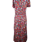 Floral dress on a mannequin against a white background