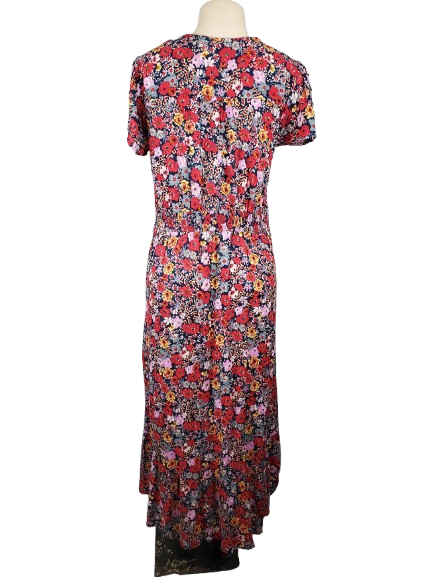 Floral dress on a mannequin against a white background