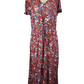 Floral dress on a mannequin against a white background