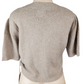 Beige knitted crop top on a mannequin against a white background