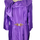 Purple dress on a mannequin with a white background