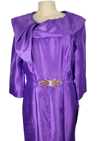 Purple dress on a mannequin with a white background