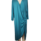 Teal dress on a mannequin against a white background