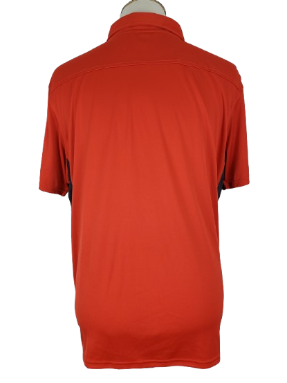 orange polo shirt on a mannequin with a white background
