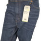 Blue jeans with a Levi's tag on a white background