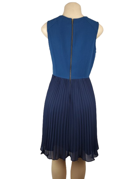 Blue dress on a mannequin against a white background