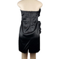 Black strapless dress on a mannequin against a white background