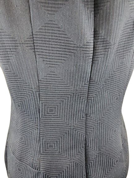 Close-up of a blue textured fabric with geometric pattern
