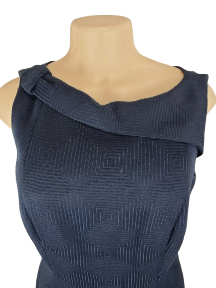 Navy blue geometric-patterned dress on a mannequin with a white background