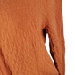 Women’s orange textured zip-up hoodie with tie detail and front pockets displayed on mannequin.