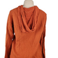 Women’s orange textured zip-up hoodie with tie detail and front pockets displayed on mannequin.