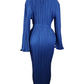 Blue pleated dress on a mannequin against a white background