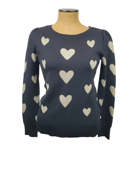 black sweater with heart patterns on a mannequin against a white background