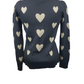 black sweater with beige heart patterns on a mannequin against a white background