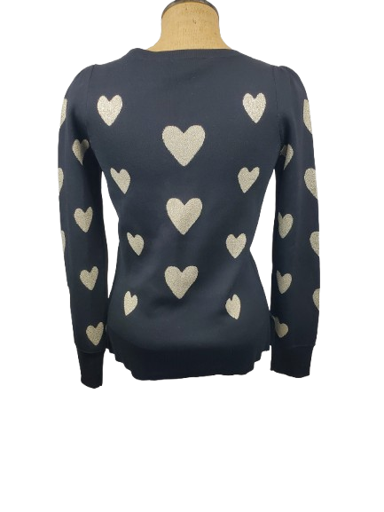 black sweater with beige heart patterns on a mannequin against a white background