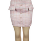 Pink textured skirt with buttons on a mannequin against a white background