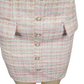 Skirt with button details on a mannequin against a white background