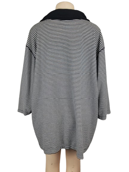 Black and white striped dress on a mannequin against a white background