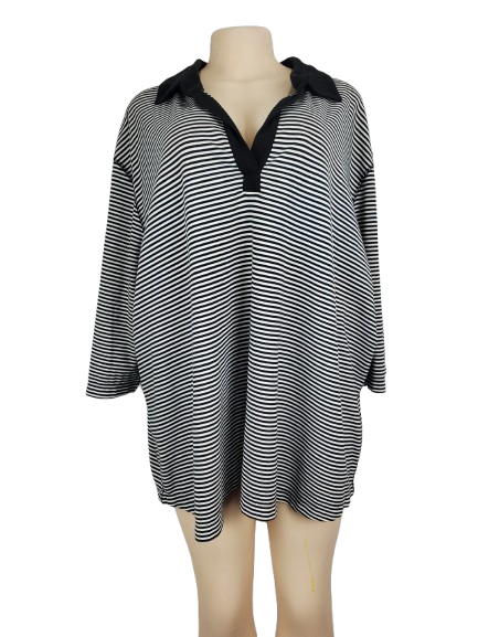Black and white striped dress with black trim on a mannequin against a white background
