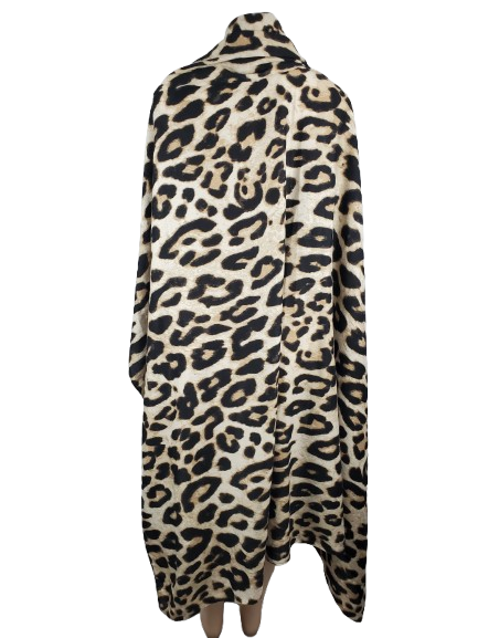 Leopard print poncho on a white background