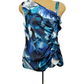 Blue floral one-shoulder dress on a mannequin against a white background