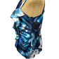 Blue and white floral patterned dress on a mannequin against a white background