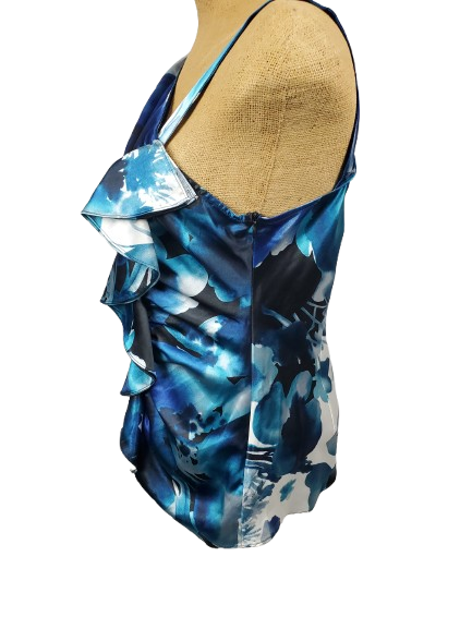 Blue and white floral patterned dress on a mannequin against a white background