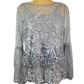 Silver sequin top on a mannequin against a white background