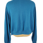 Blue sweater on a mannequin against a white background