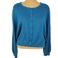 Blue cardigan on a mannequin against a white background