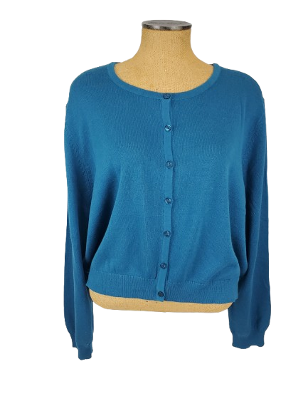 Blue cardigan on a mannequin against a white background
