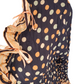 brown top with colorful polka dot pattern and ruffled sleeves on a white background
