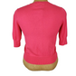 Pink women’s button front short sleeve cardigan sweater displayed on mannequin.