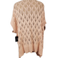 peach knitted cardigan on a mannequin against a white background