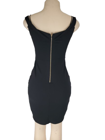 Black dress with a gold zipper on a mannequin against a white background