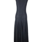 Black lace dress on a mannequin against a white background