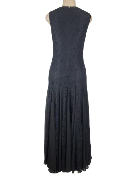 Black lace dress on a mannequin against a white background