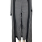 Houndstooth patterned pants on a mannequin with a black cardigan.
