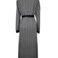 Black and white houndstooth patterned dress on a mannequin against a white background