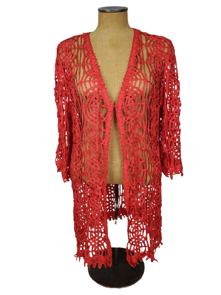 Red crochet cover-up on a mannequin against a white background
