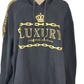 Black hoodie with gold chain design and 'Luxury Limited Edition' text on a mannequin.